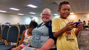 Kellie Trout and her children Zariah (left) and Kylin at Tools For Education, July 27 at the Center for People in Need.