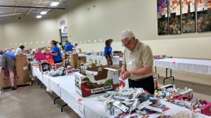 County Commissioner Bill Avery helping to sort supplies at Tools For Education July 27 at the Center for People in Need
