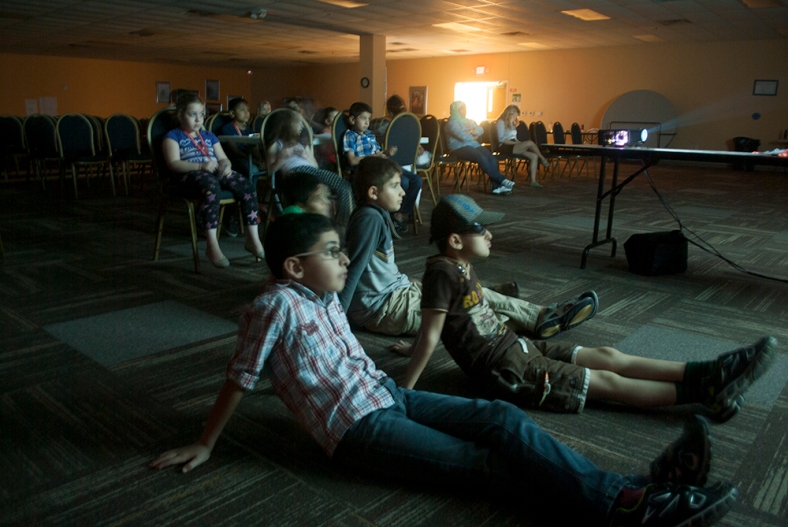 Our Summer Program kids watching a movie